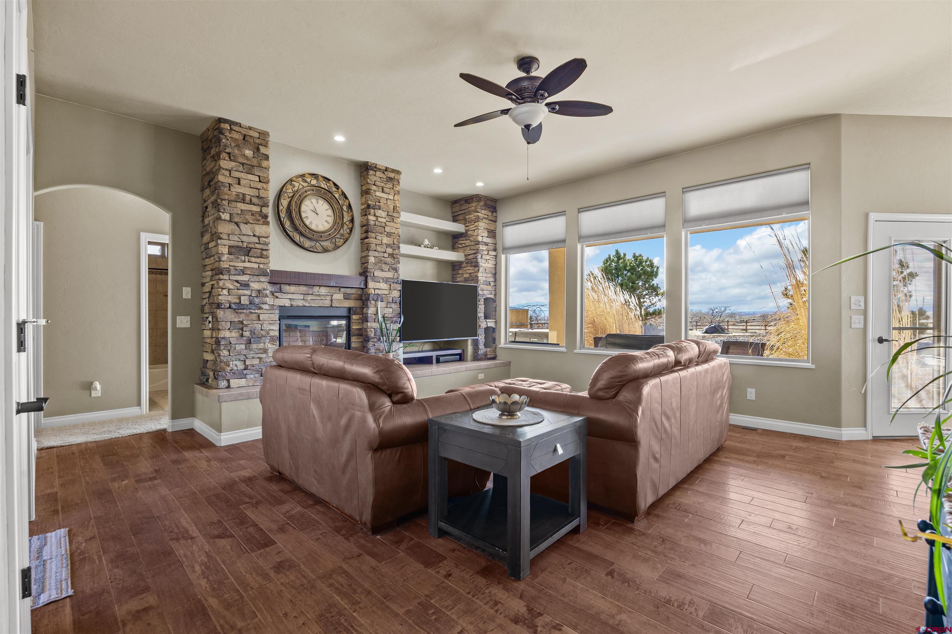 9838 5650th Road Olathe, CO 81425 - Photo 27 of 44 a living room with furniture and a large window