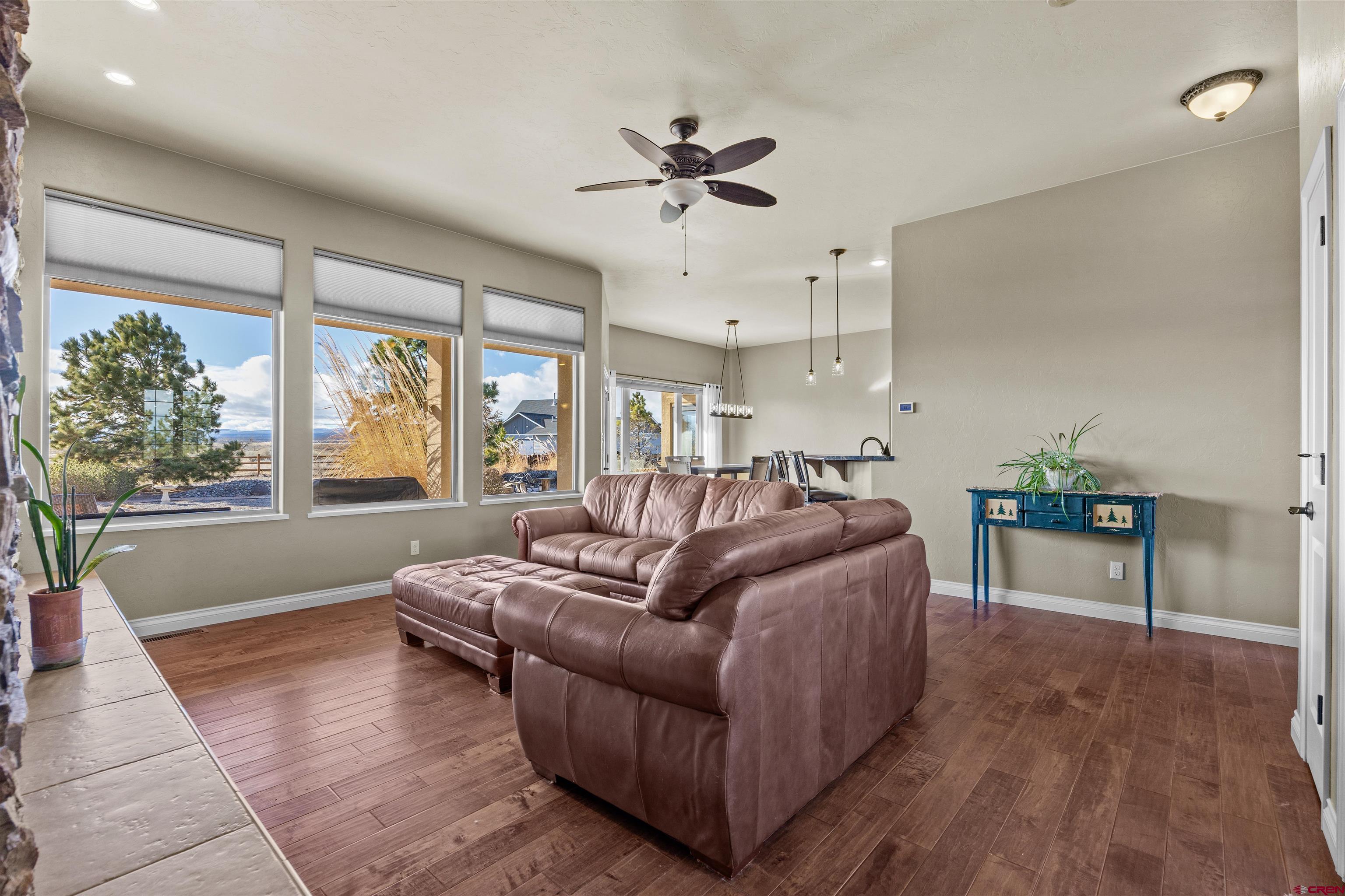 9838 5650th Road Olathe, CO 81425 - Photo 28 of 44 a living room with furniture and a large window