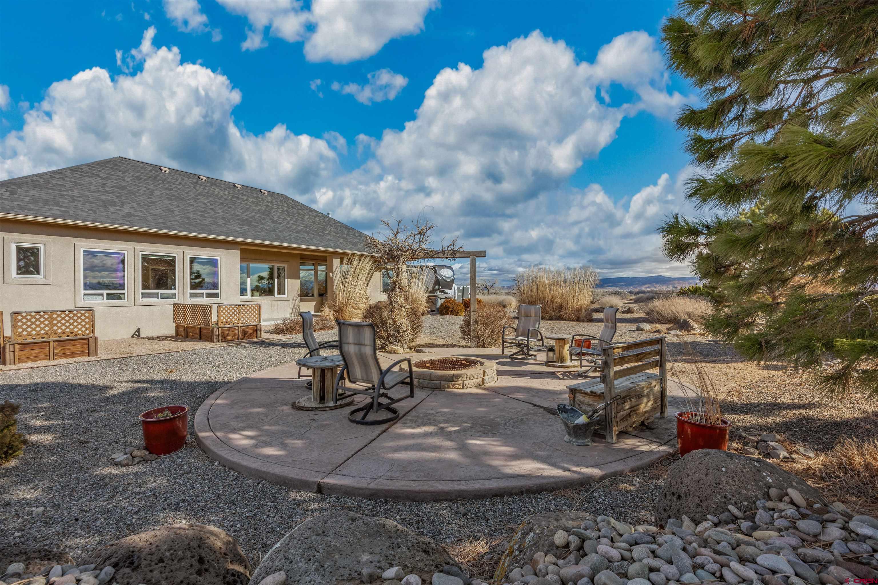 9838 5650th Road Olathe, CO 81425 - Photo 31 of 44 a view of a house with backyard