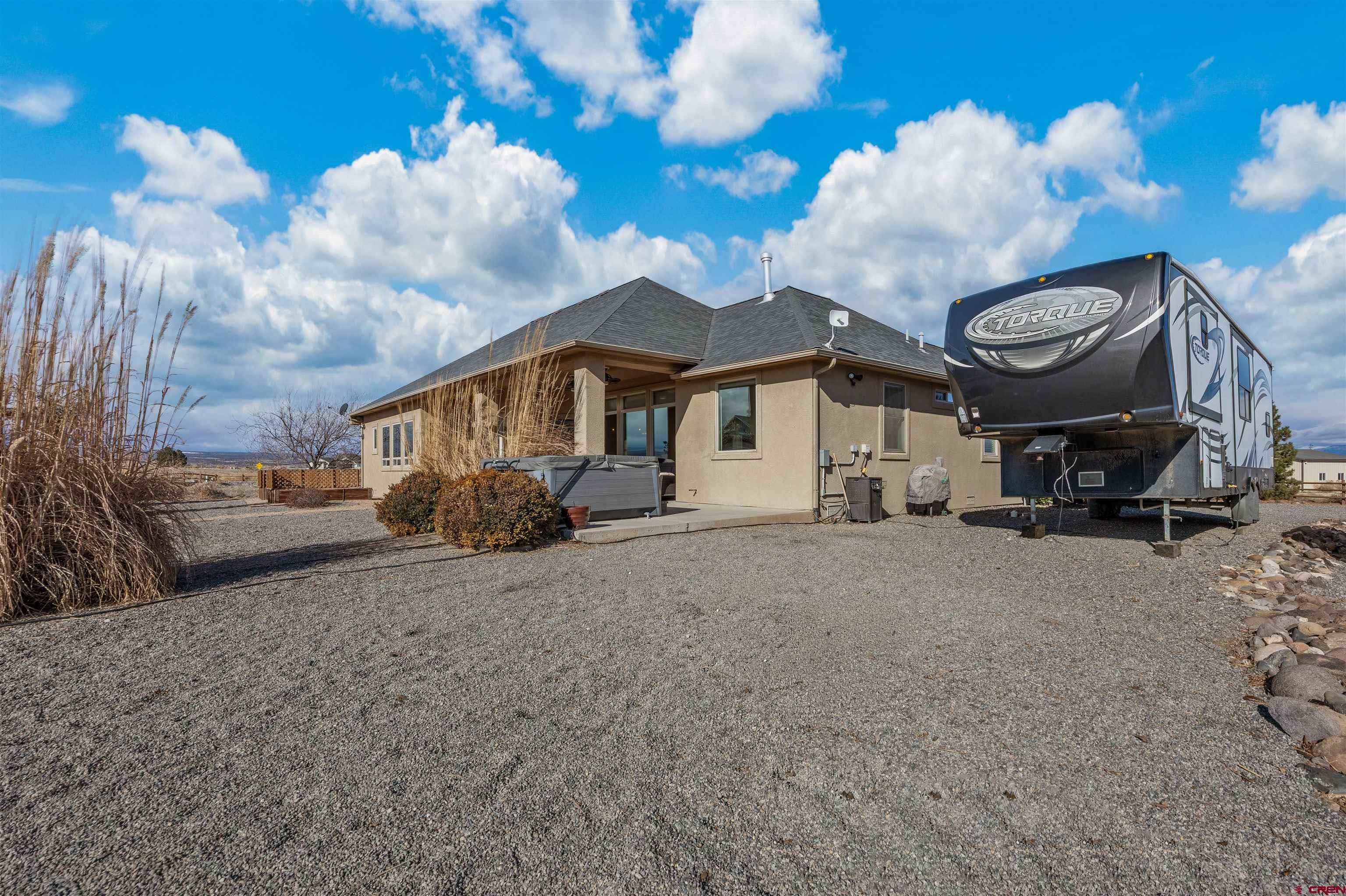 9838 5650th Road Olathe, CO 81425 - Photo 32 of 44 a view of a house with a backyard