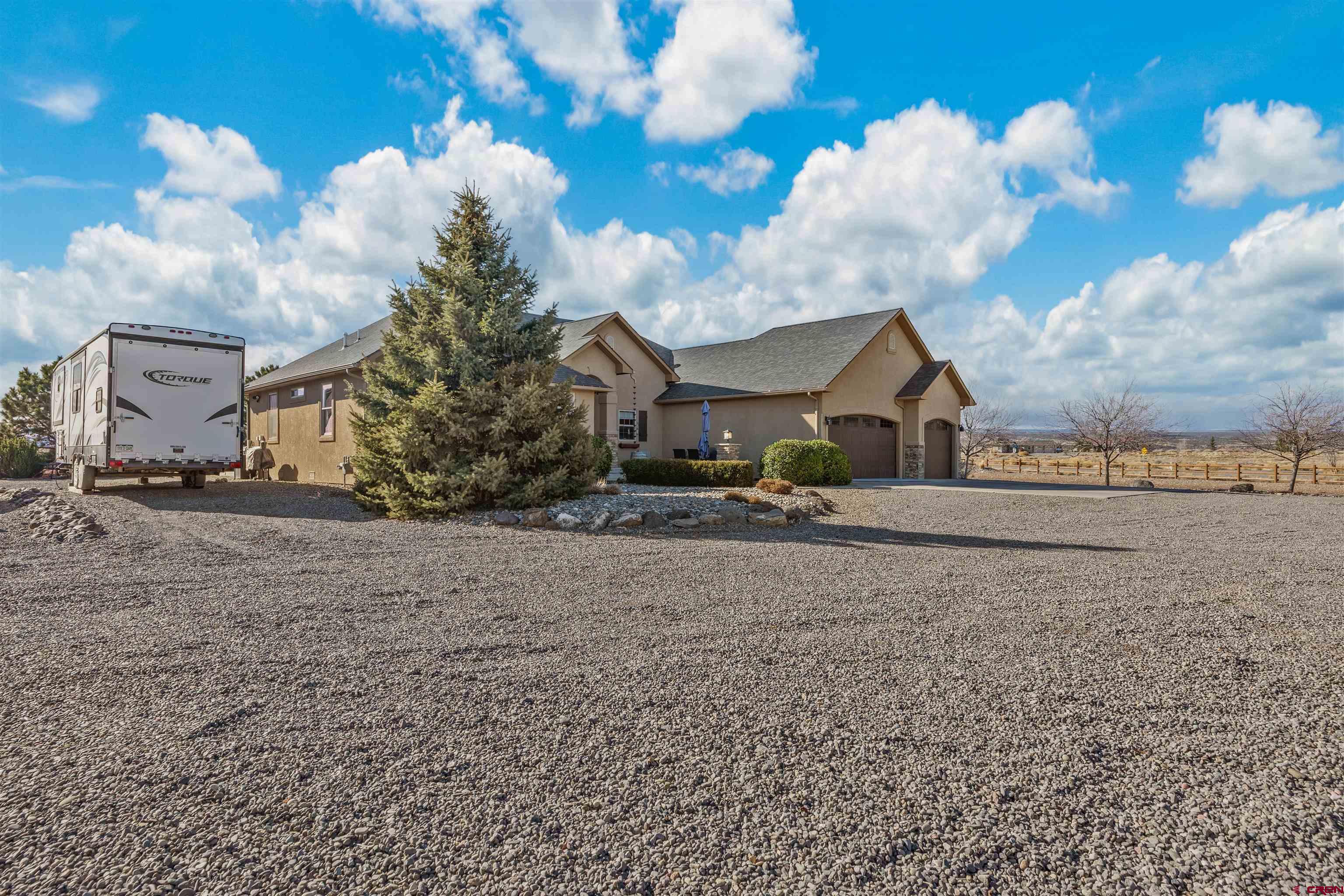 9838 5650th Road Olathe, CO 81425 - Photo 43 of 44 a view of a house with a yard