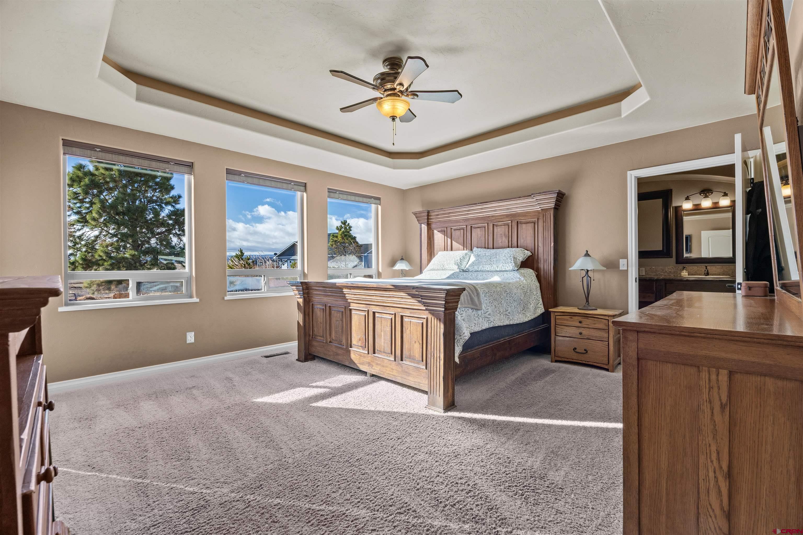 9838 5650th Road Olathe, CO 81425 - Photo 8 of 44 a bedroom with a bed and window