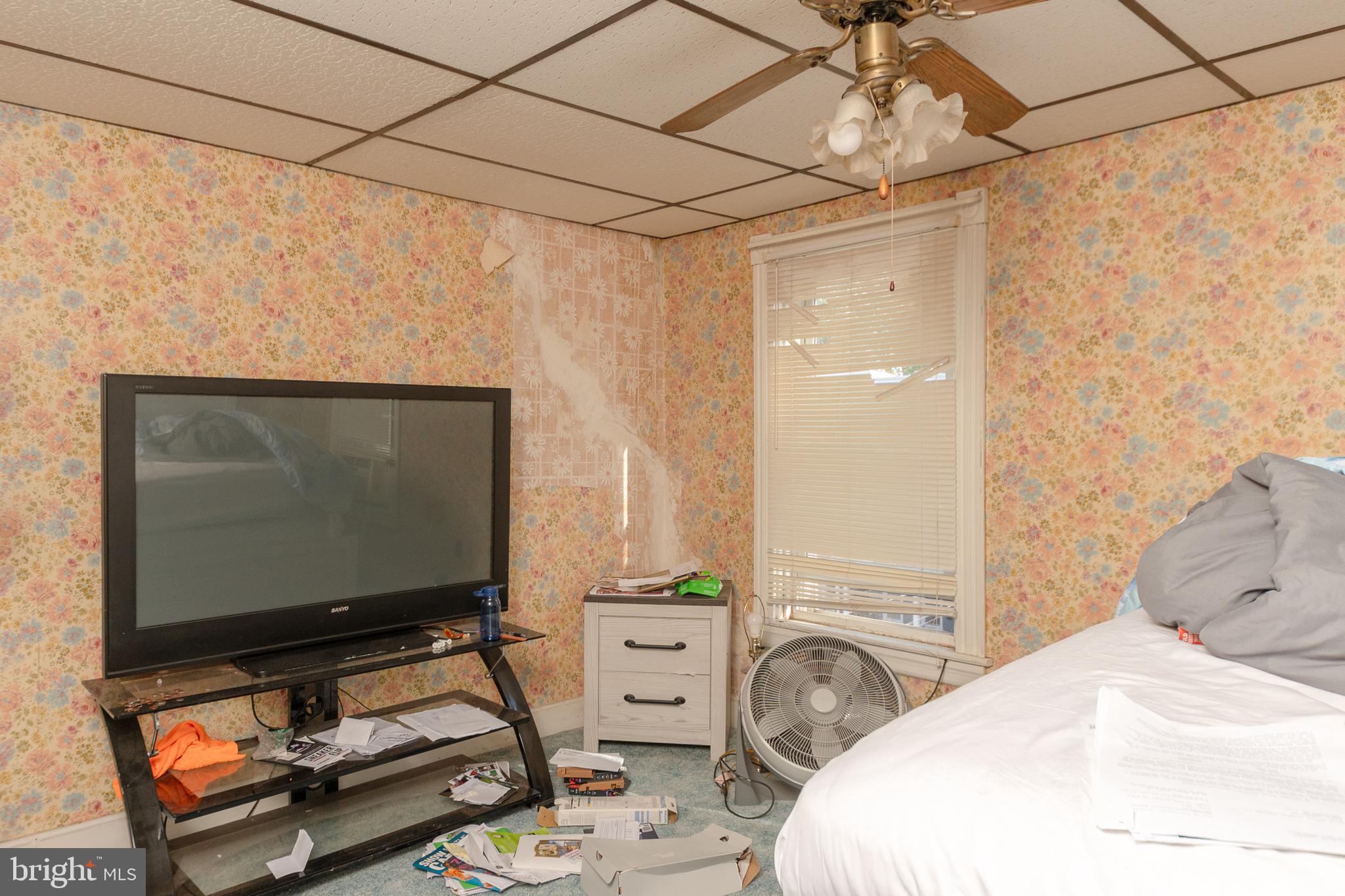 758 South Lime Street Lancaster, PA 17602 - Photo 3 of 28 a bedroom with a bed and a flat screen tv