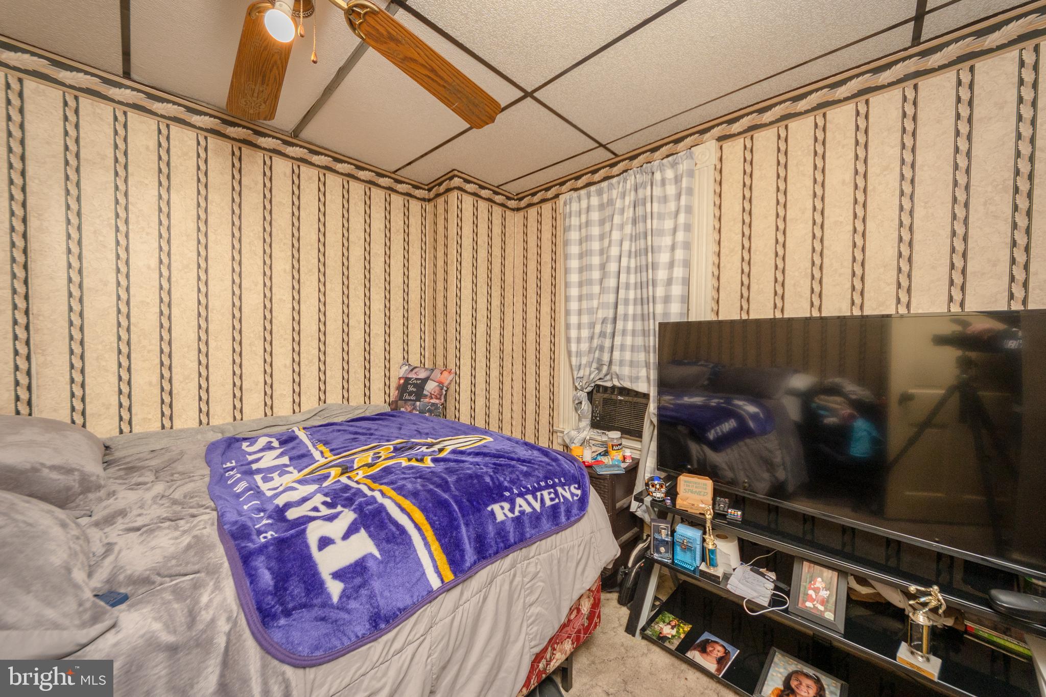 758 South Lime Street Lancaster, PA 17602 - Photo 6 of 28 a bedroom with a bed and a flat tv screen