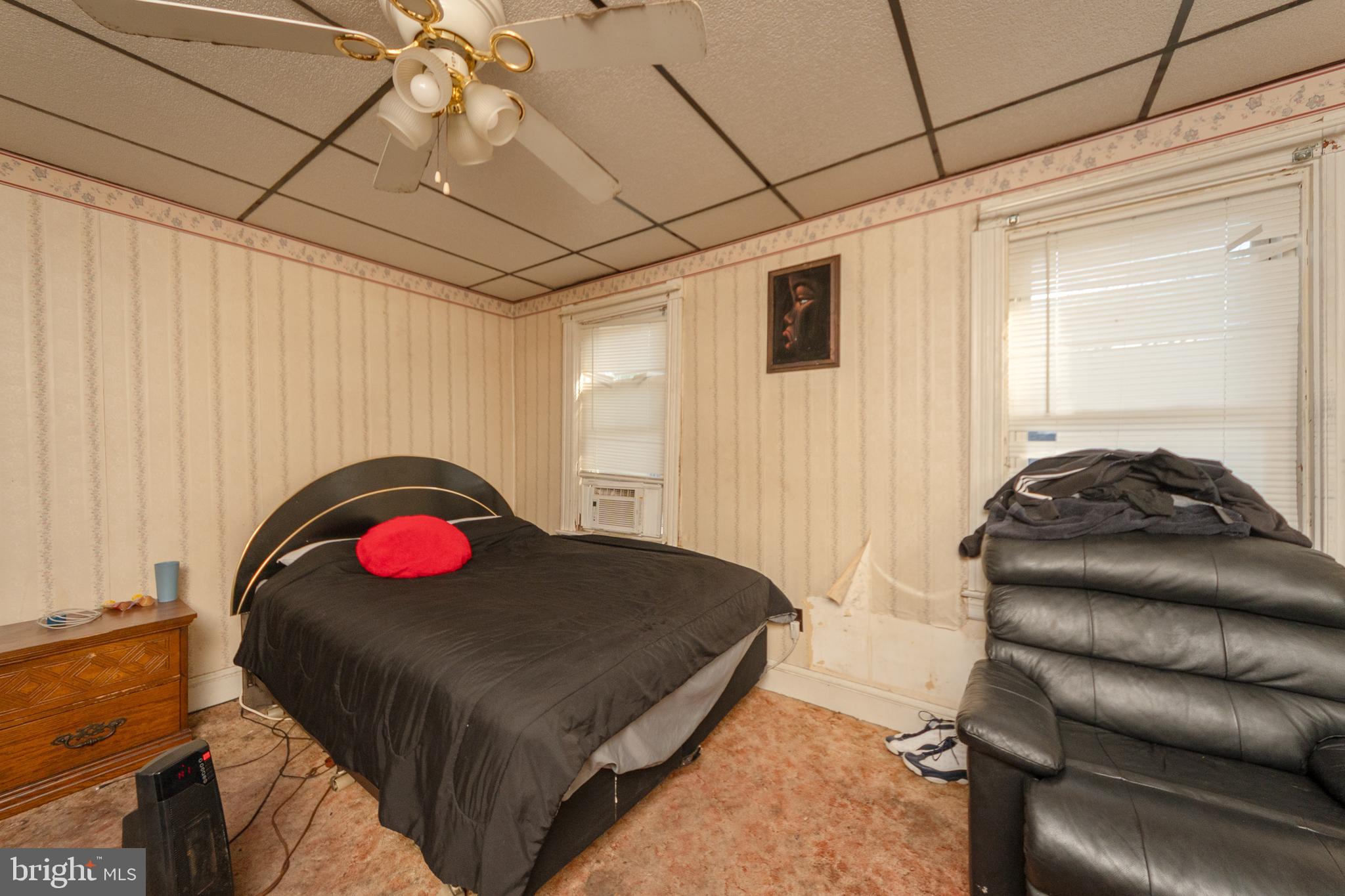758 South Lime Street Lancaster, PA 17602 - Photo 8 of 28 a bedroom with a bed and a chandelier