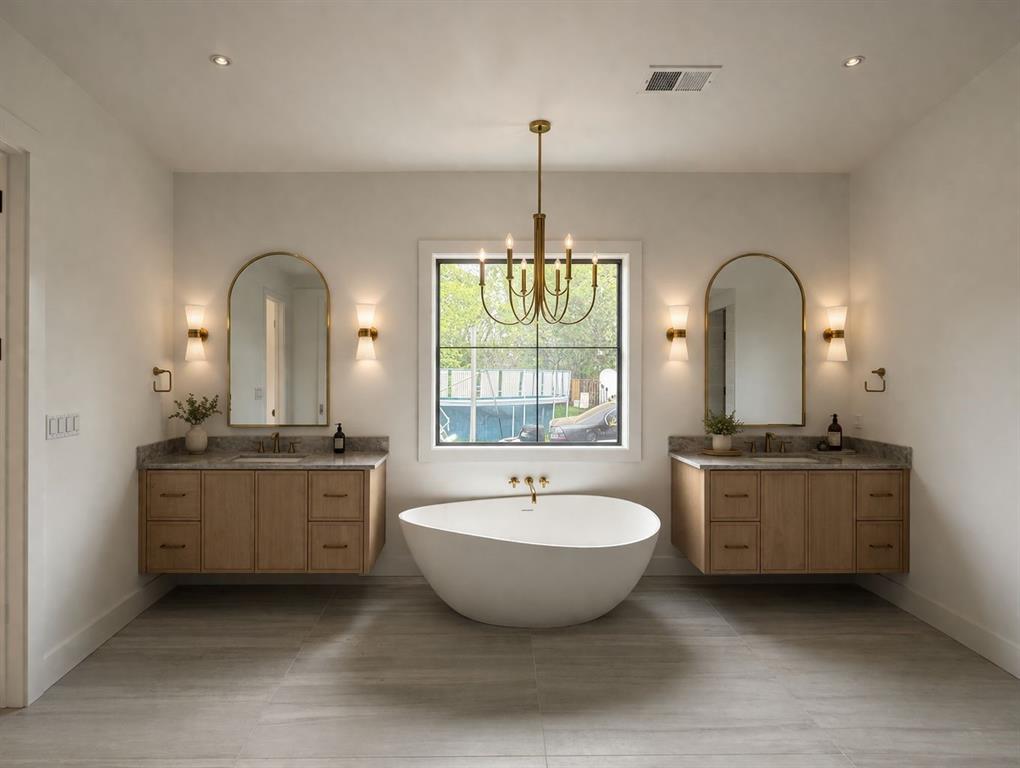 3928 Hawick Lane Dallas, TX 75220 - Photo 5 of 7 a spacious bathroom with a granite countertop sink and a mirror