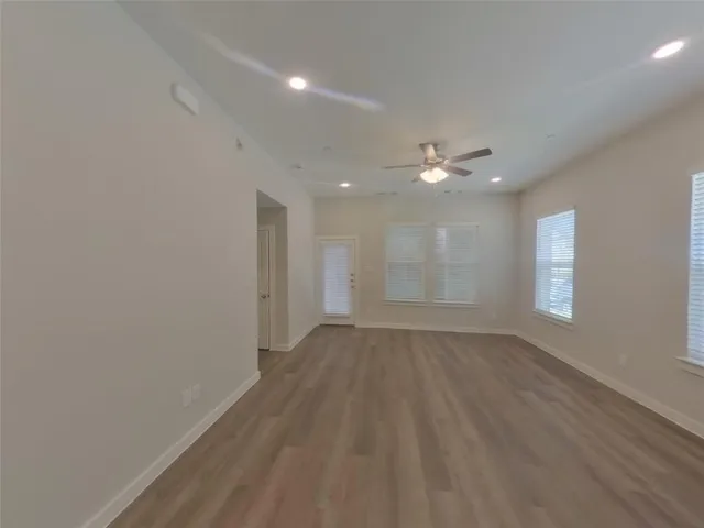 a view of an empty room with a window