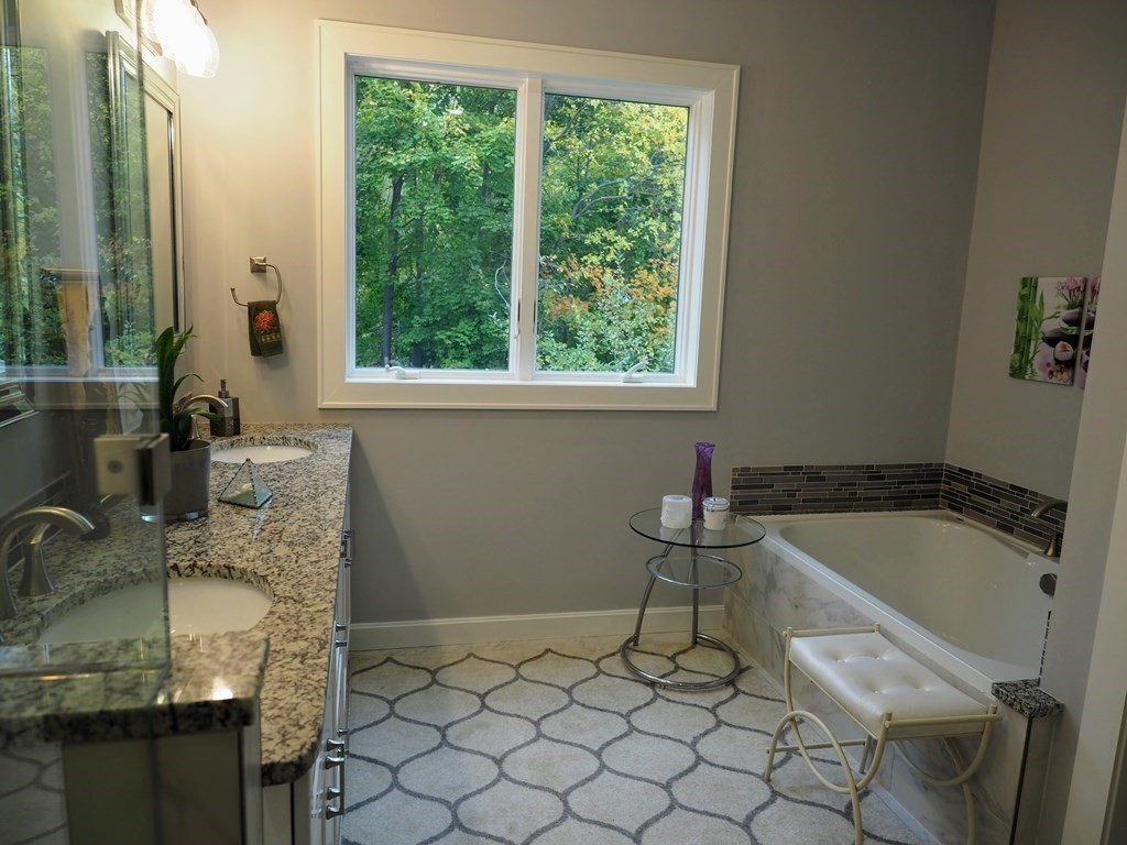 9 York Road Newton, MA 02468 - Photo 19 of 41 a bathroom with a granite countertop sink and a bathtub
