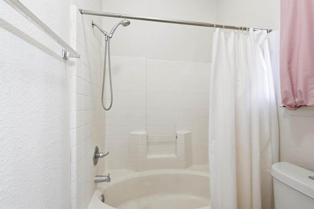 801 Indigo Terrace Denton, TX 76209 - Photo 28 of 40 a bathroom with a shower and a shower