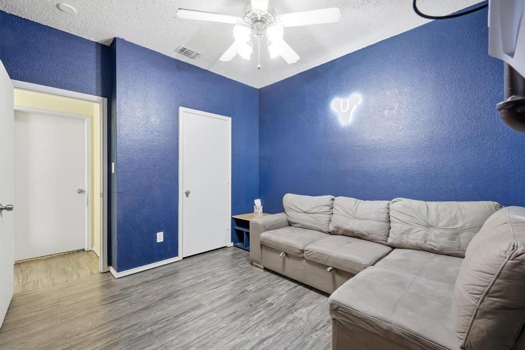 801 Indigo Terrace Denton, TX 76209 - Photo 30 of 40 a living room with couches and painted walls
