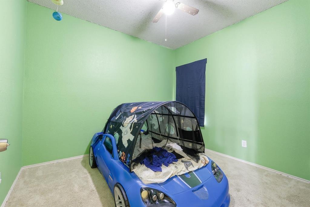 801 Indigo Terrace Denton, TX 76209 - Photo 32 of 40 a living room with furniture