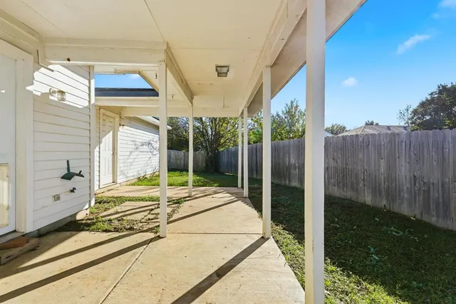 a bed sitting in front of a window