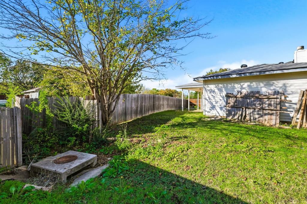 801 Indigo Terrace Denton, TX 76209 - Photo 36 of 40 a backyard of a house with lots of green space