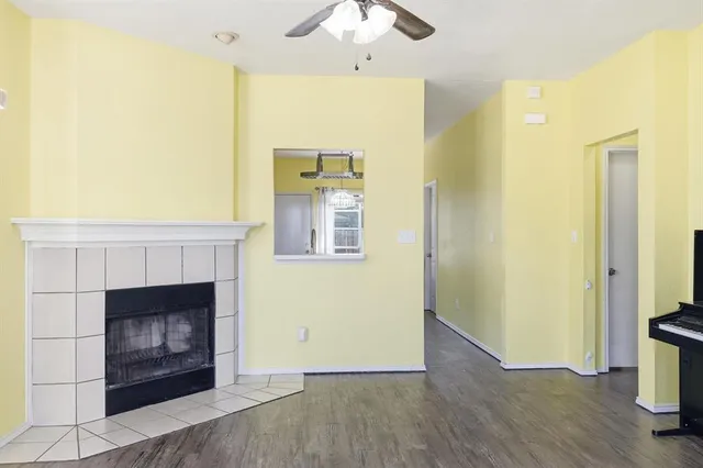 a view of an empty room with a fireplace