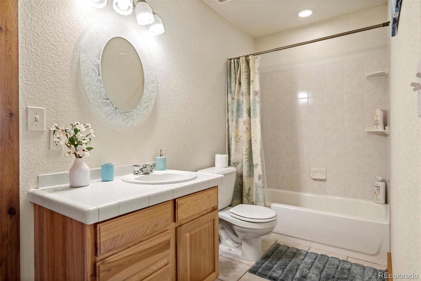 412 Evergreen Road Black Hawk, CO 80422 - Photo 33 of 48 a bathroom with a sink a toilet and a mirror