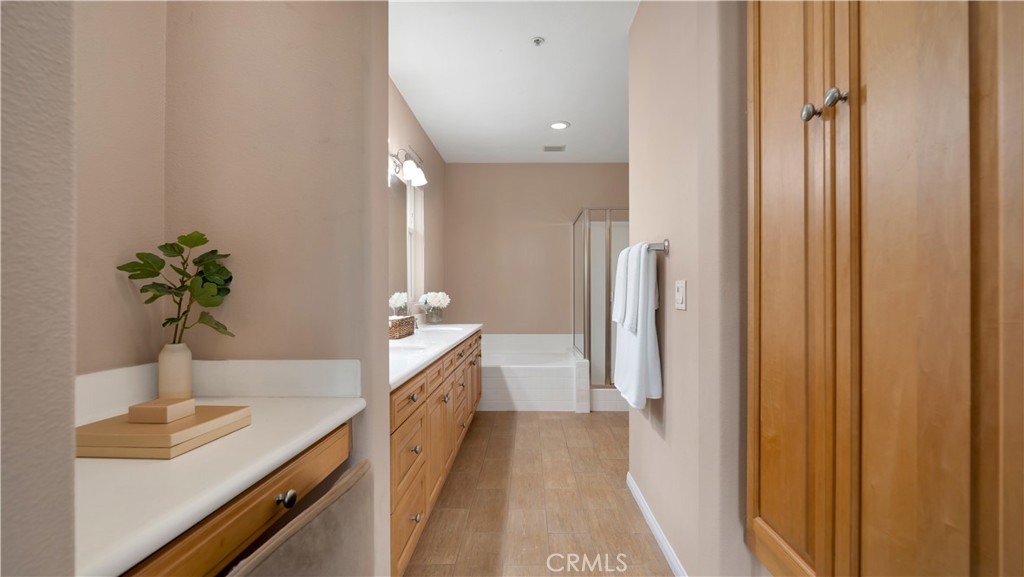 47 Nightshade Irvine, CA 92603 - Photo 13 of 56 a bathroom with a sink a mirror and a shower