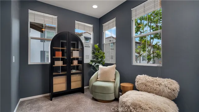 a workspace room with furniture and wooden floor
