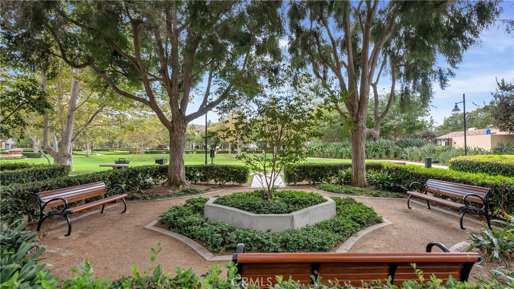 47 Nightshade Irvine, CA 92603 - Photo 38 of 56 a view of a patio with table and chairs potted plants and large tree