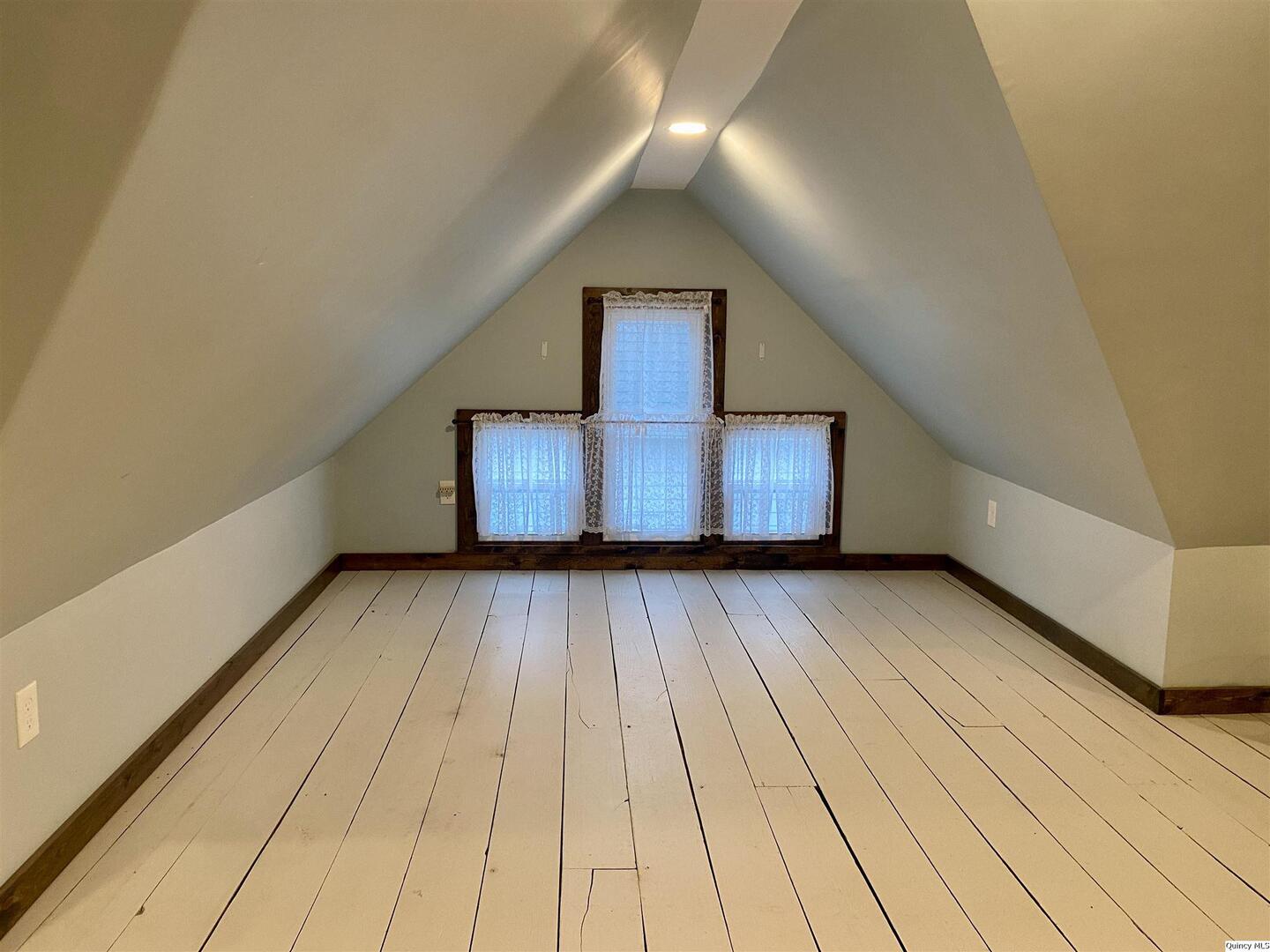 614 South 22nd Street Quincy, IL 62301 - Photo 19 of 27 a view of wooden floor in a hall with a window