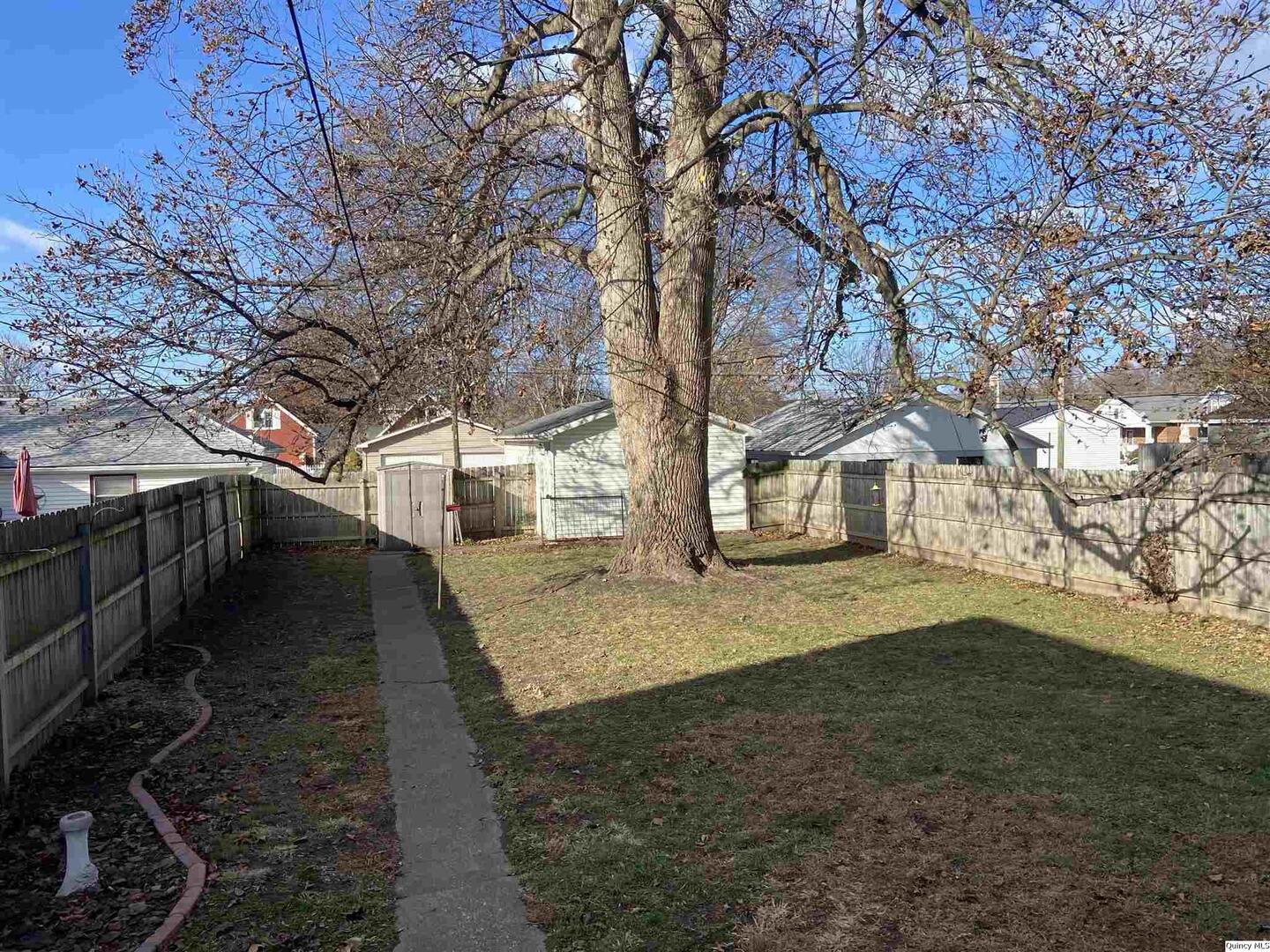 614 South 22nd Street Quincy, IL 62301 - Photo 25 of 27 a view of a yard with a tree