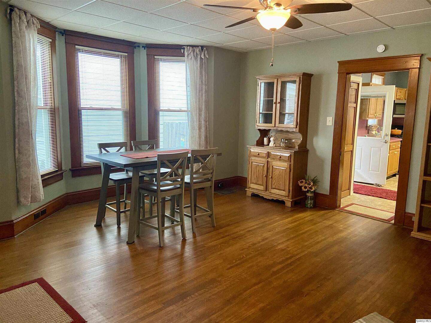 614 South 22nd Street Quincy, IL 62301 - Photo 7 of 27 a view of a dining room with furniture window and wooden floor