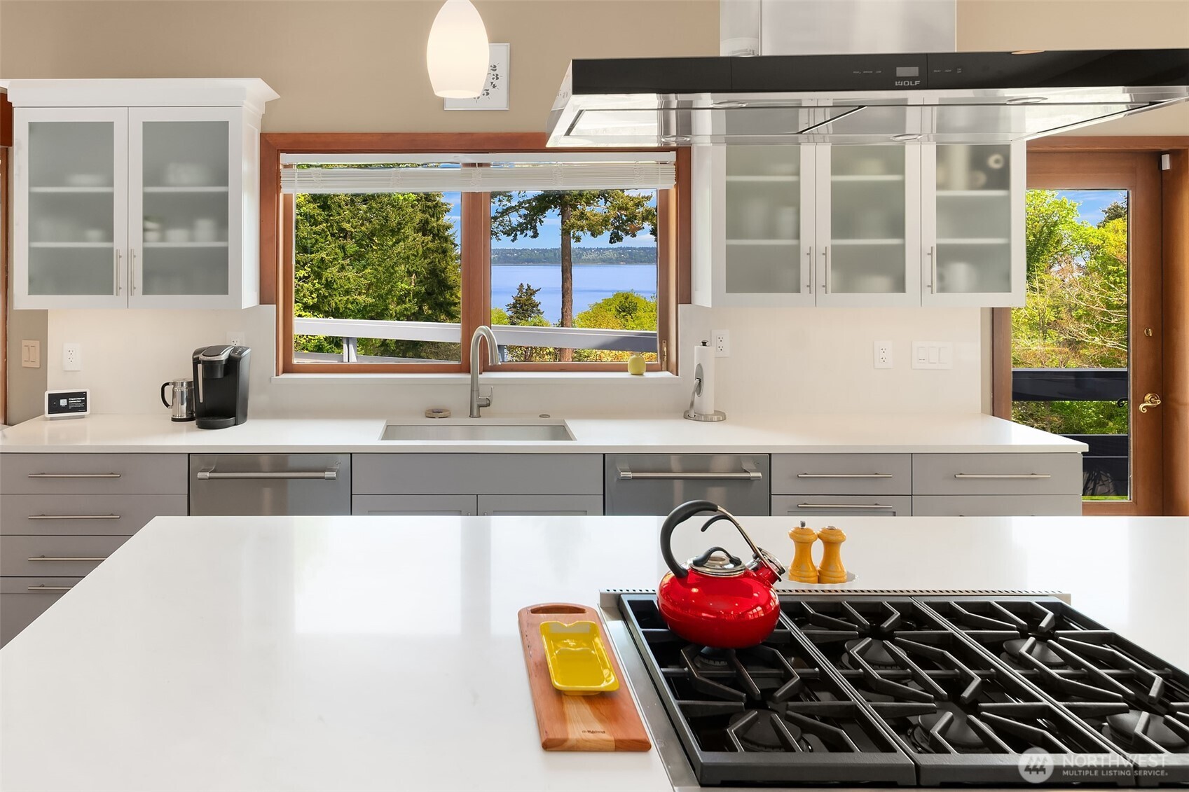 8425 Southwest 216th Street Vashon, WA 98070 - Photo 15 of 40 a kitchen with a stove a sink and a large window