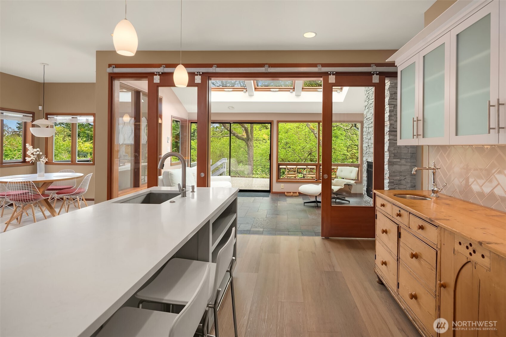 8425 Southwest 216th Street Vashon, WA 98070 - Photo 18 of 40 a large kitchen with kitchen island a large window in it