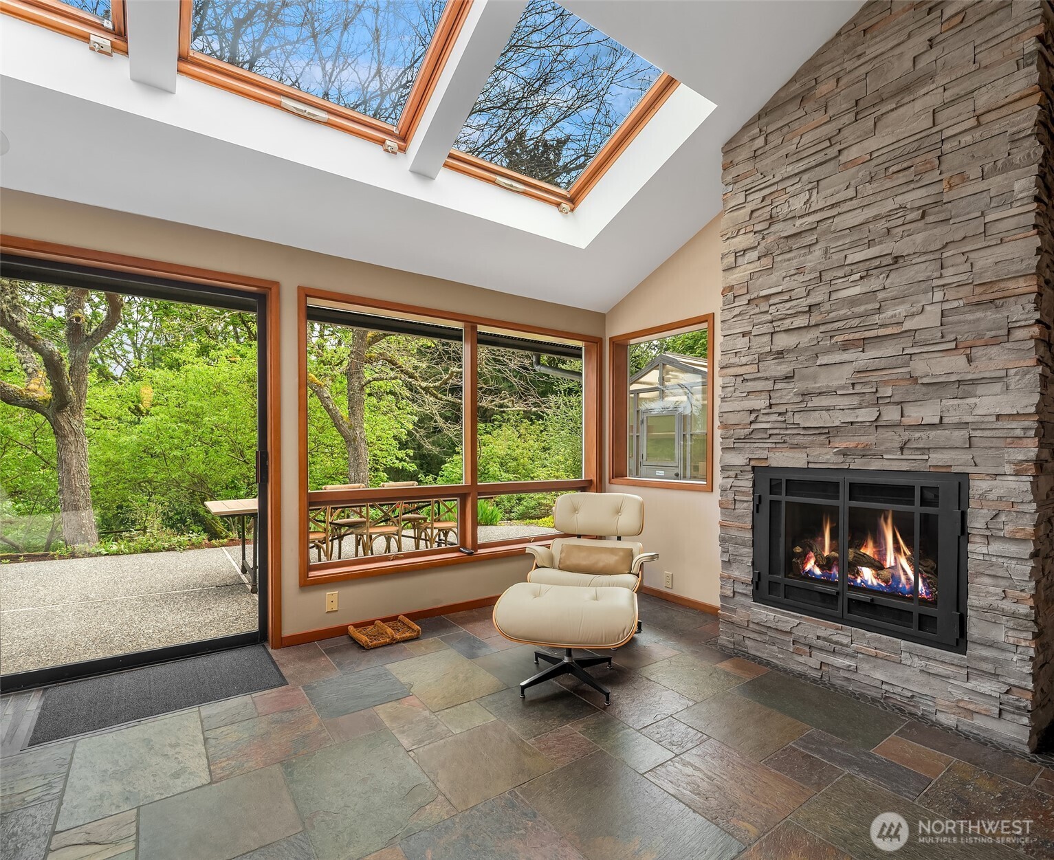 8425 Southwest 216th Street Vashon, WA 98070 - Photo 19 of 40 a living room with furniture and a fireplace