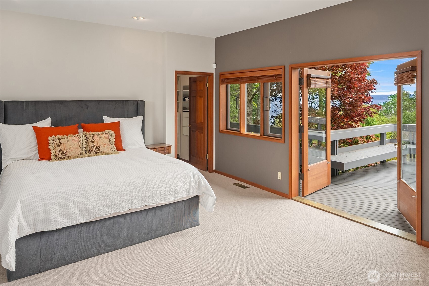 8425 Southwest 216th Street Vashon, WA 98070 - Photo 21 of 40 a bedroom with a large bed and a large window