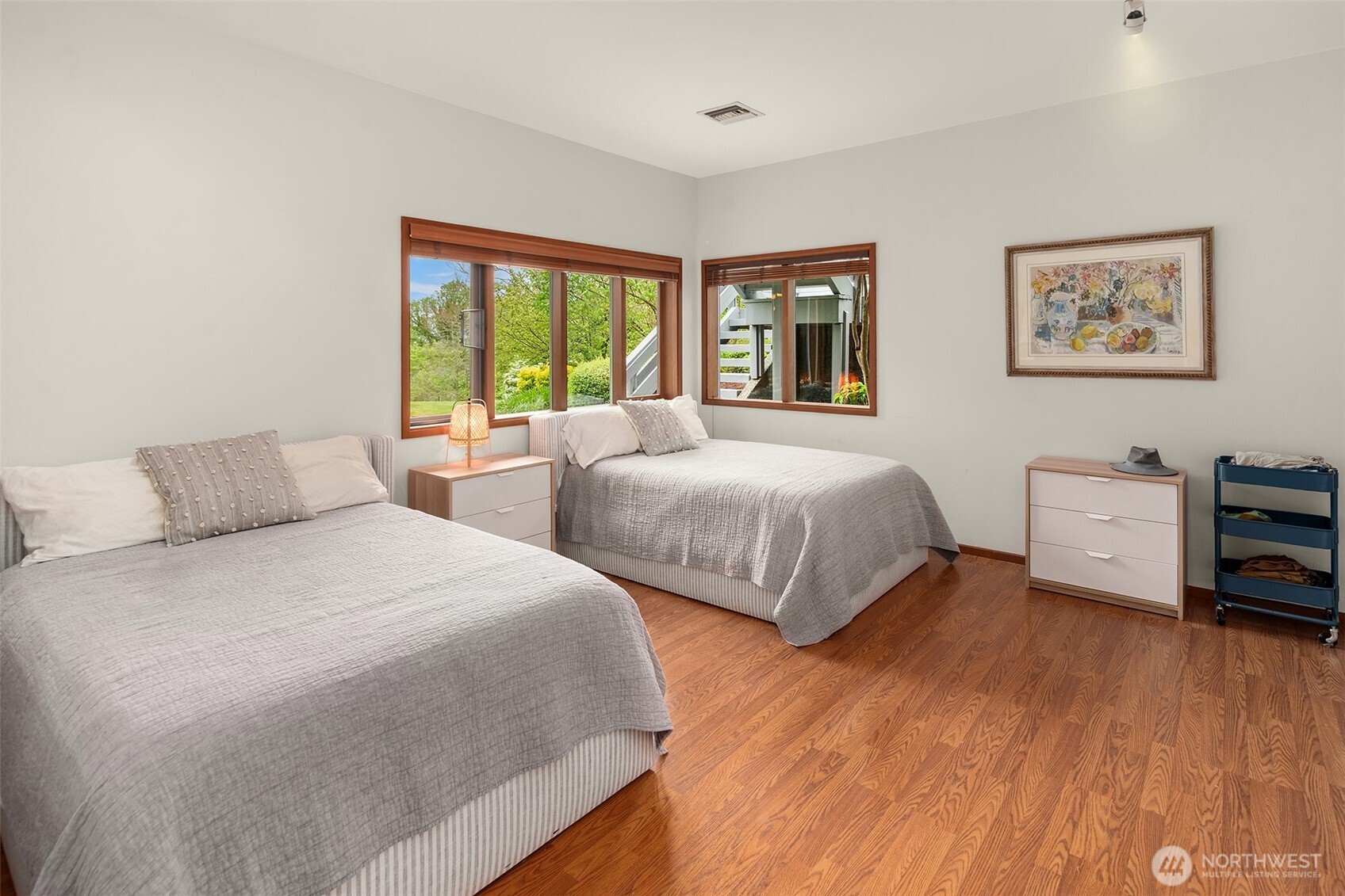 8425 Southwest 216th Street Vashon, WA 98070 - Photo 29 of 40 a bedroom with two beds and a large window
