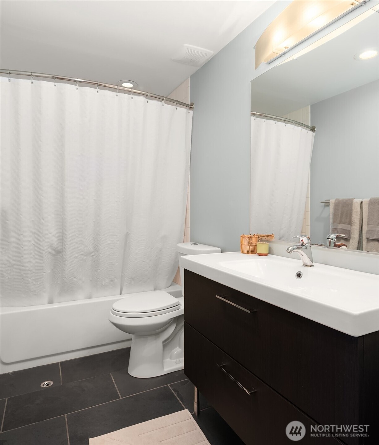 8425 Southwest 216th Street Vashon, WA 98070 - Photo 30 of 40 a bathroom with a sink a toilet and shower