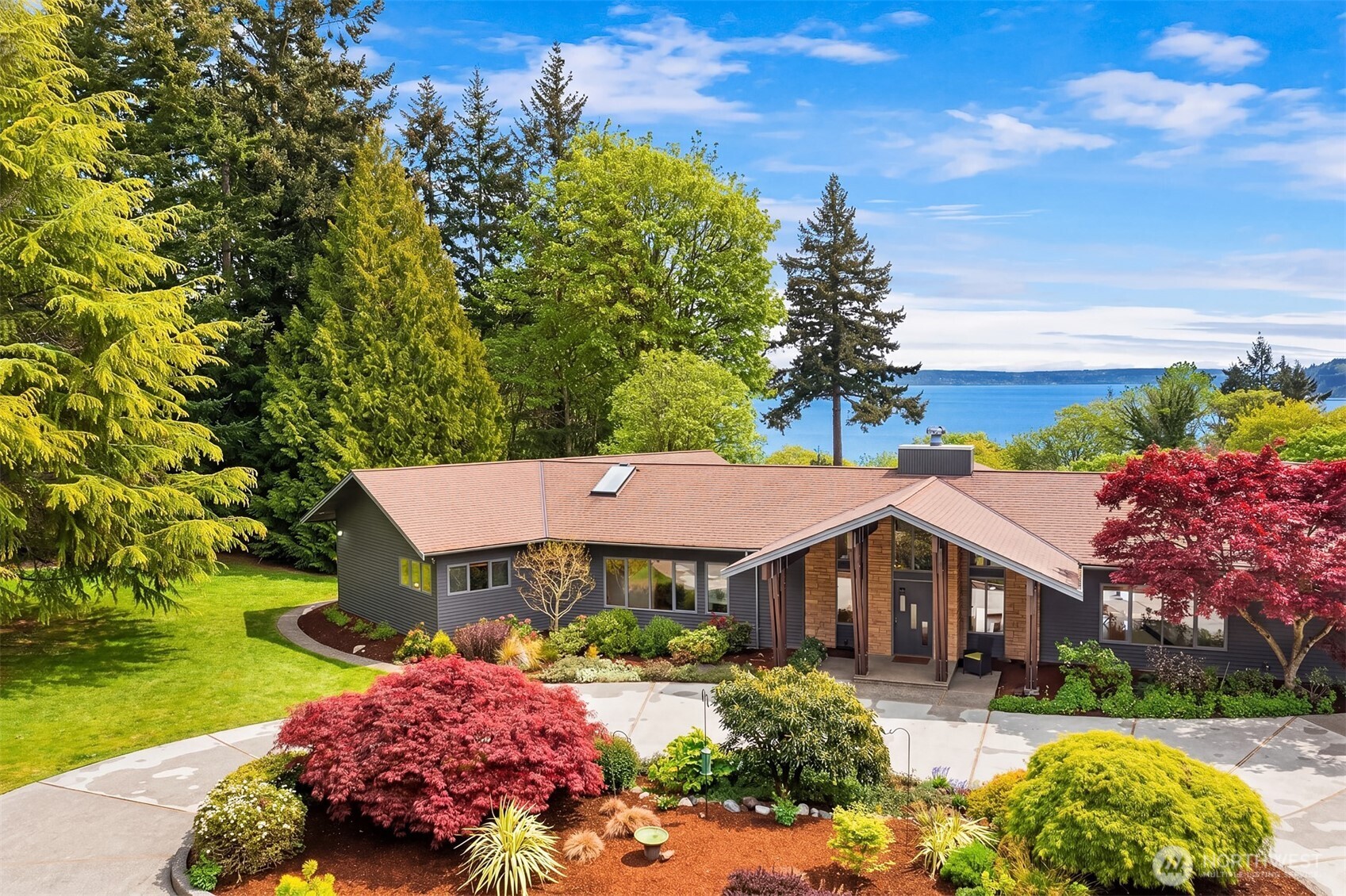 8425 Southwest 216th Street Vashon, WA 98070 - Photo 3 of 40 a front view of a house with a yard