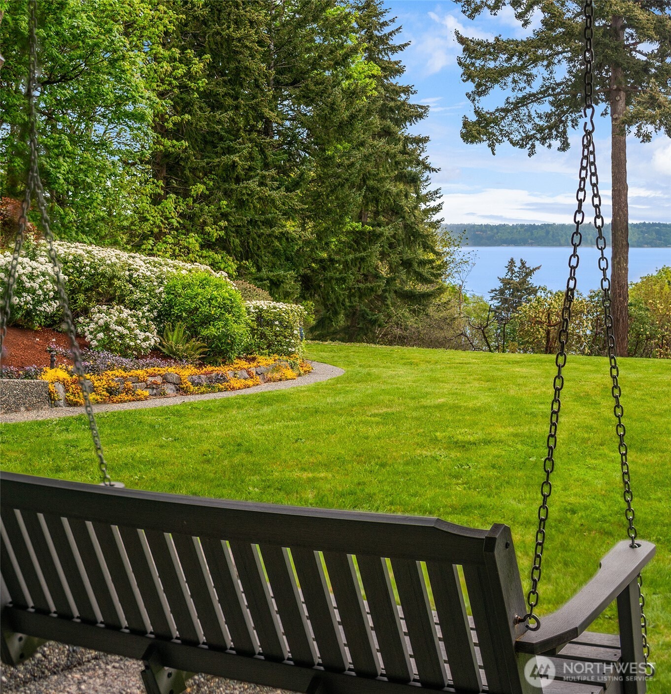 8425 Southwest 216th Street Vashon, WA 98070 - Photo 32 of 40 a view of a wooden deck and a garden