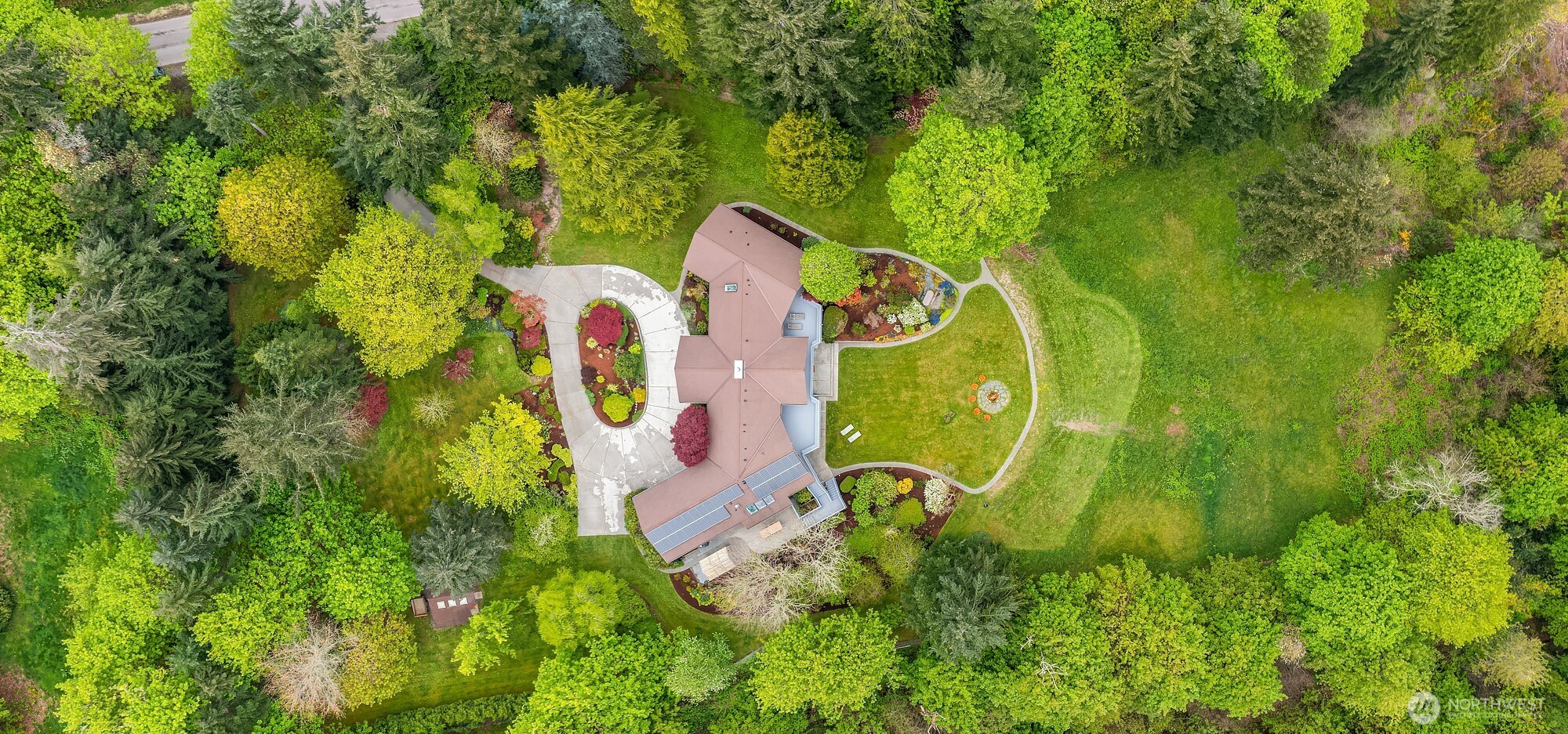 8425 Southwest 216th Street Vashon, WA 98070 - Photo 40 of 40 an aerial view of a house with a swimming pool and garden