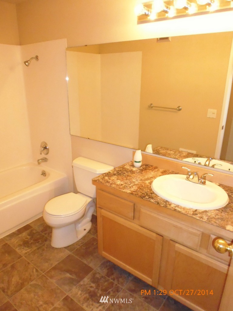 335 Heather Road, Unit 307 Everett, WA 98203 - Photo 12 of 16 a bathroom with a sink a toilet and shower