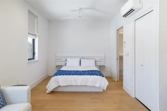 a bedroom with furniture and a window