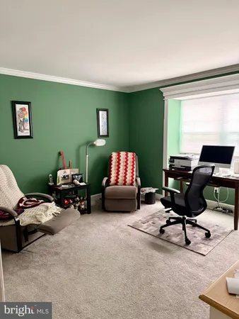 a bedroom with a workspace