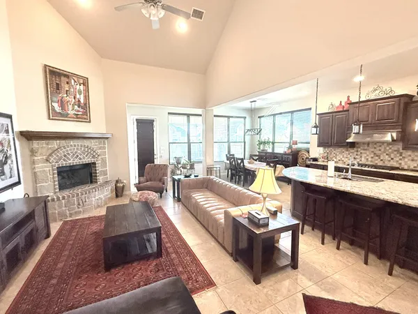 a living room with furniture and a fireplace