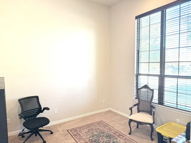 a workspace with furniture and a window