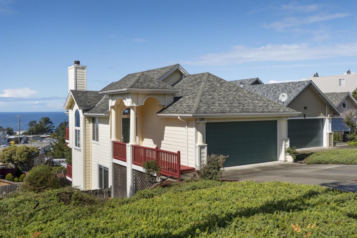554 Monterey Road Pacifica, CA 94044 - Photo 1 of 32 a front view of a house with a yard