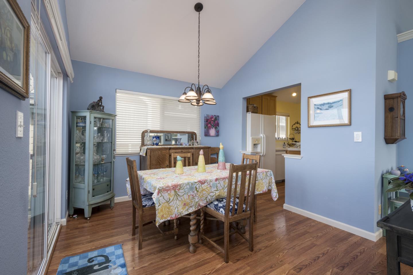 554 Monterey Road Pacifica, CA 94044 - Photo 14 of 32 a view of a dining room with furniture and wooden floor