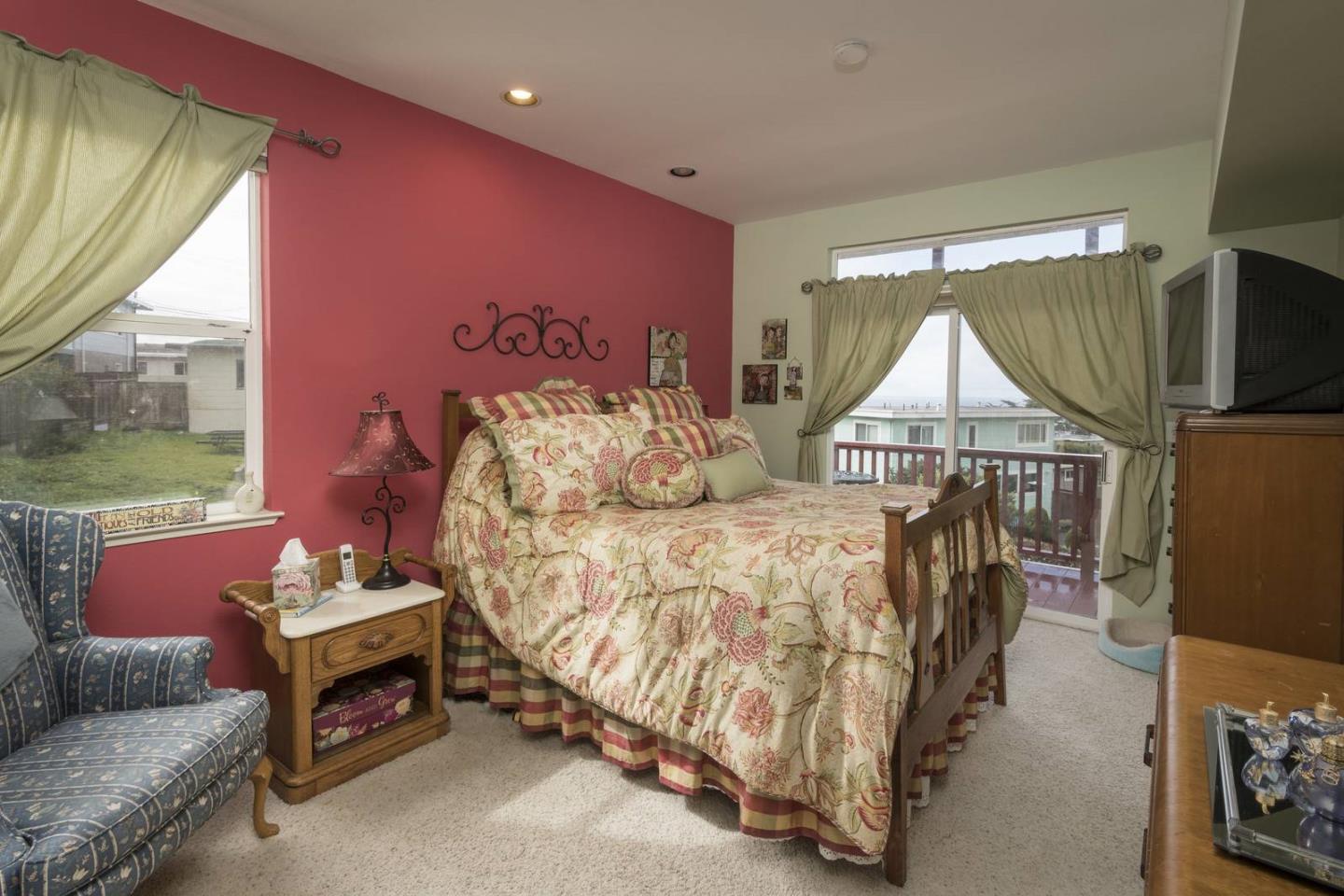 554 Monterey Road Pacifica, CA 94044 - Photo 21 of 32 a bedroom with furniture and a window