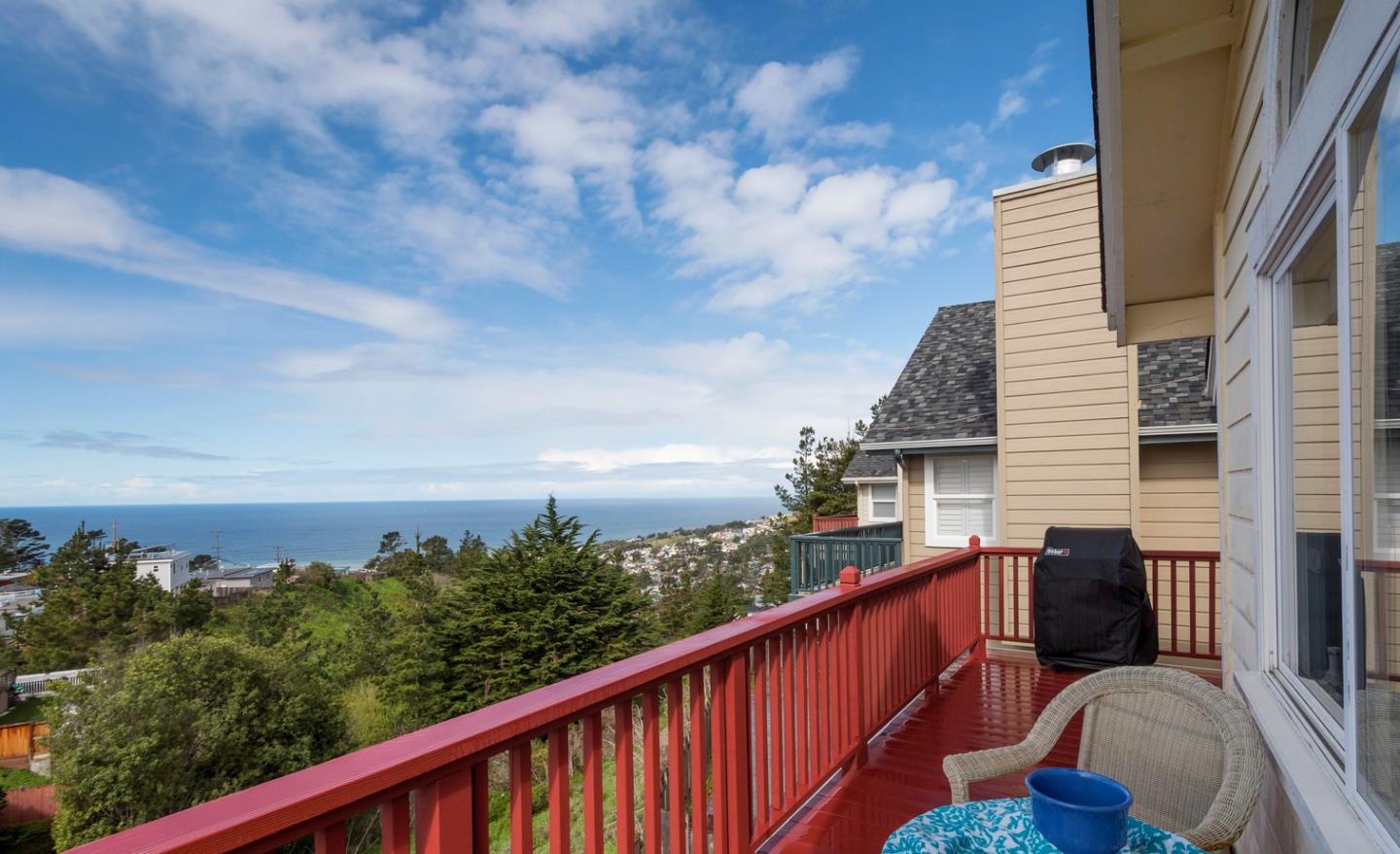 554 Monterey Road Pacifica, CA 94044 - Photo 27 of 32 a view of a balcony with wooden floor and fence