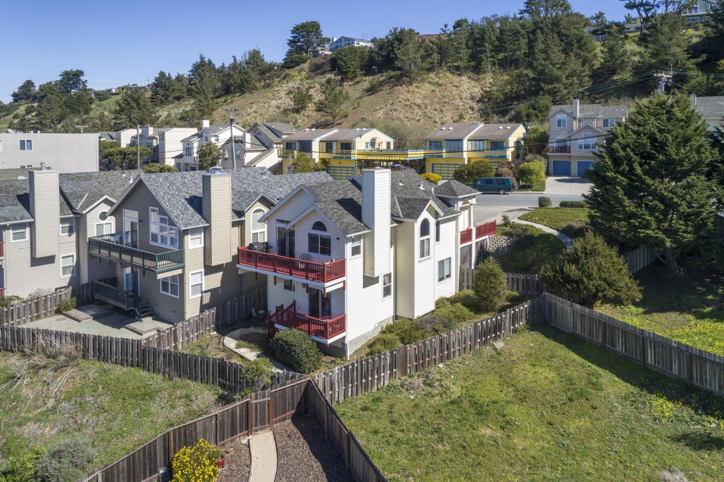 554 Monterey Road Pacifica, CA 94044 - Photo 3 of 32 a view of multiple houses with a yard