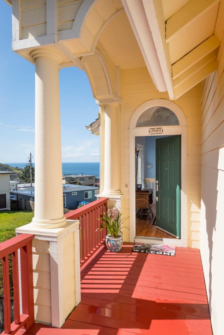 554 Monterey Road Pacifica, CA 94044 - Photo 5 of 32 a view of a balcony with wooden floor and outdoor seating