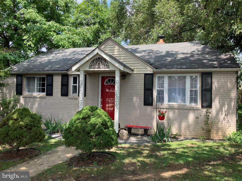 3303 Janet Road Silver Spring, MD 20906 - Photo 1 of 31 a house with lots of trees in the background