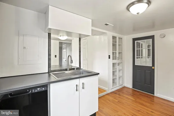 a view of a kitchen from the hallway