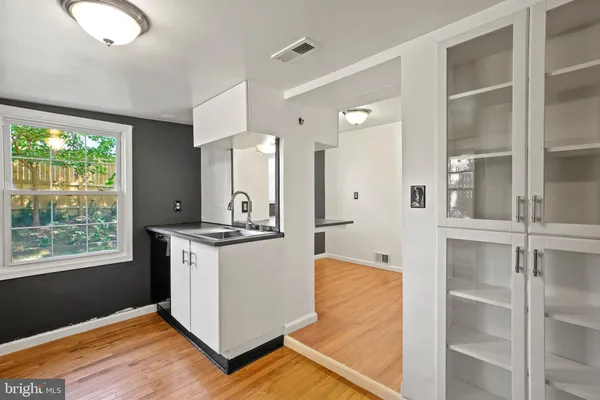 a kitchen with stainless steel appliances granite countertop a stove a refrigerator and a cabinets