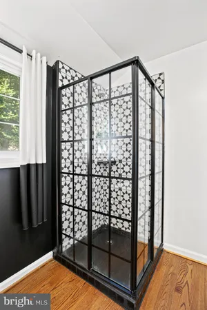 a view of front door with wooden floor