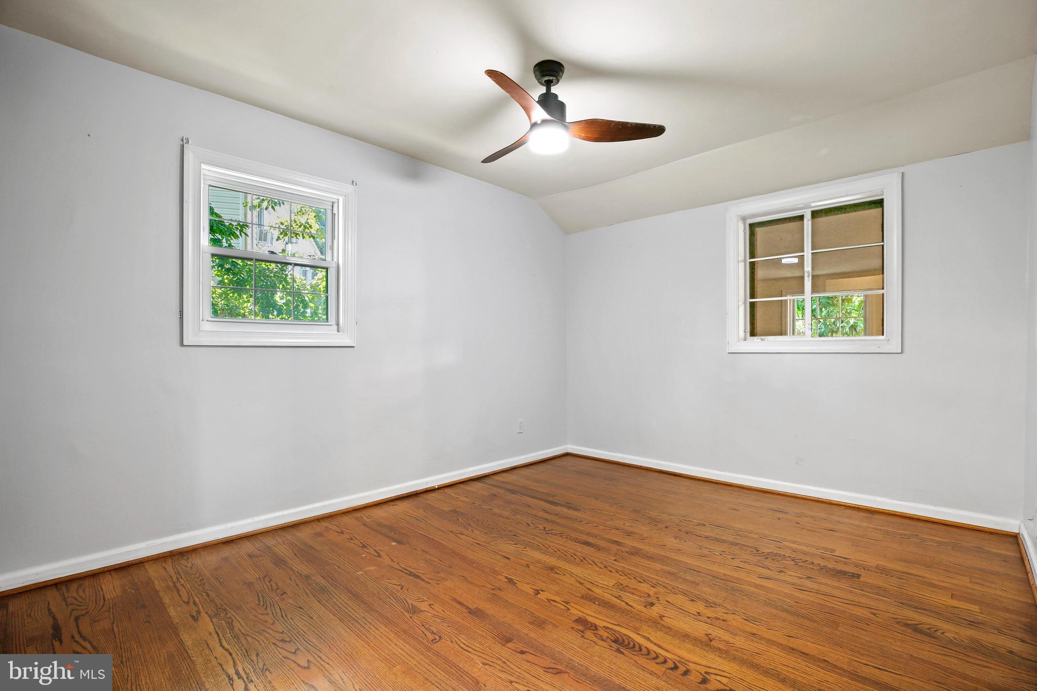 3303 Janet Road Silver Spring, MD 20906 - Photo 20 of 31 a view of an empty room with wooden floor and a window